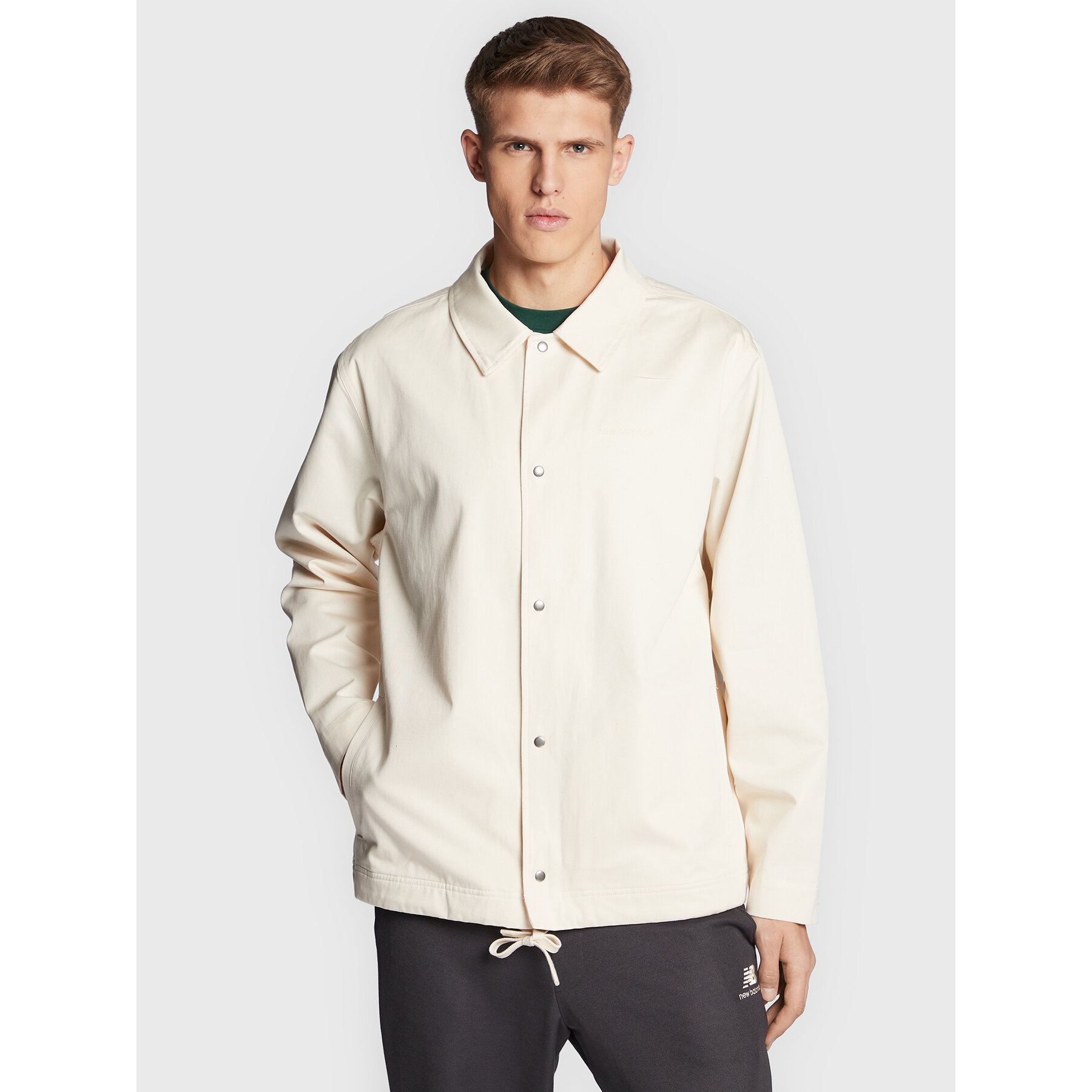 New Balance Übergangsjacke Athletics Nature State MJ23552 Beige Relaxed Fit