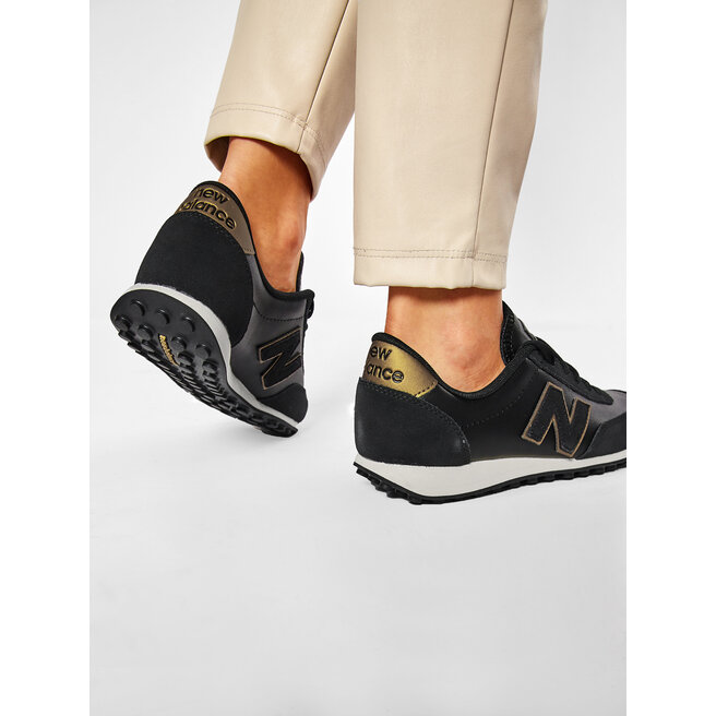 New balance u410 top negro y dorado