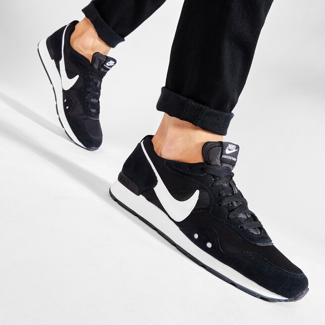 nike black venture runner trainers
