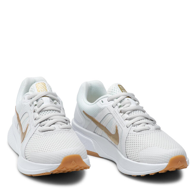 Nike Cipő Nike Run Swift 2 CU3528 010 Platinum Tint/Mtlx Gold Star
