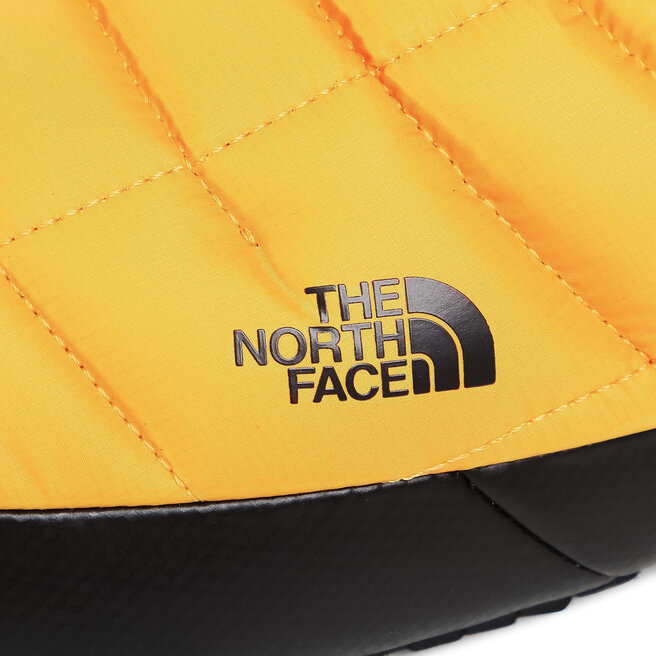 The North Face Papuci de casă The North Face Thermoball Traction Mule V NF0A3UZNZU31 Summit Gold/Tnf Black