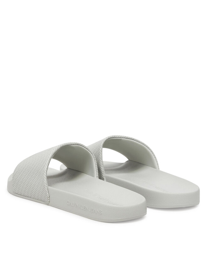 Calvin Klein Jeans Pantoletten Calvin Klein Jeans Slide Aop Print YM0YM01269 Grau