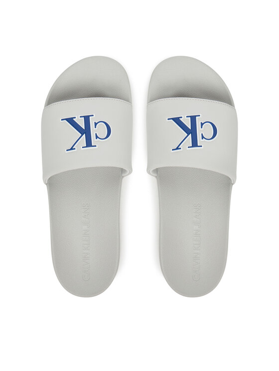 Calvin Klein Jeans Natikači Calvin Klein Jeans Slide Jelly Mono Pu YM0YM01281 Siva