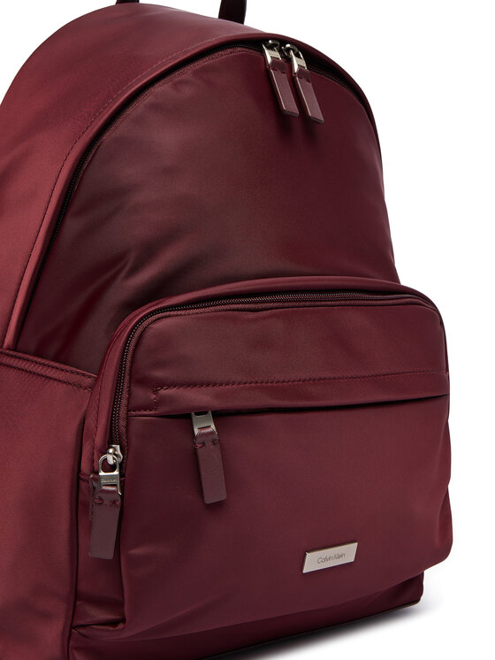 Calvin Klein Nahrbtnik Calvin Klein Sleek Round LV04D3143G Bordo rdeča