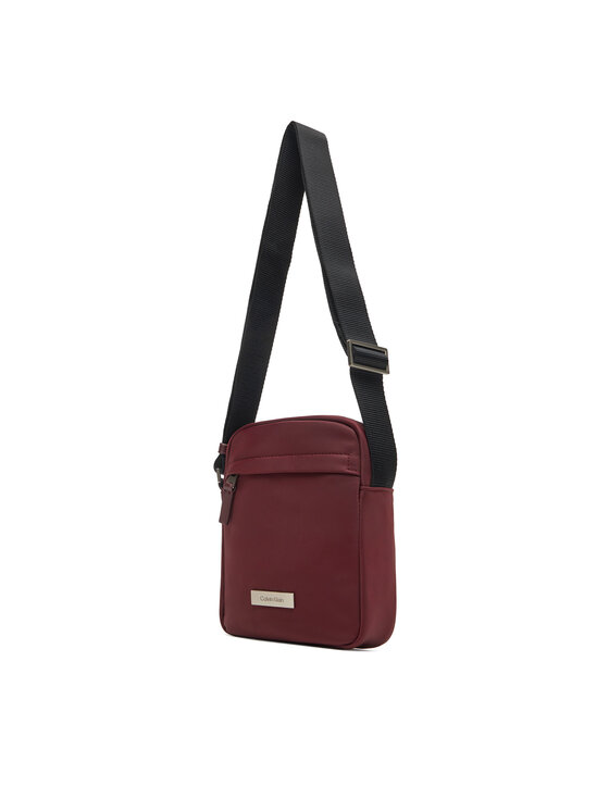 Calvin Klein Saszetka Calvin Klein Sleek Reporter LV04D3180G Bordowy