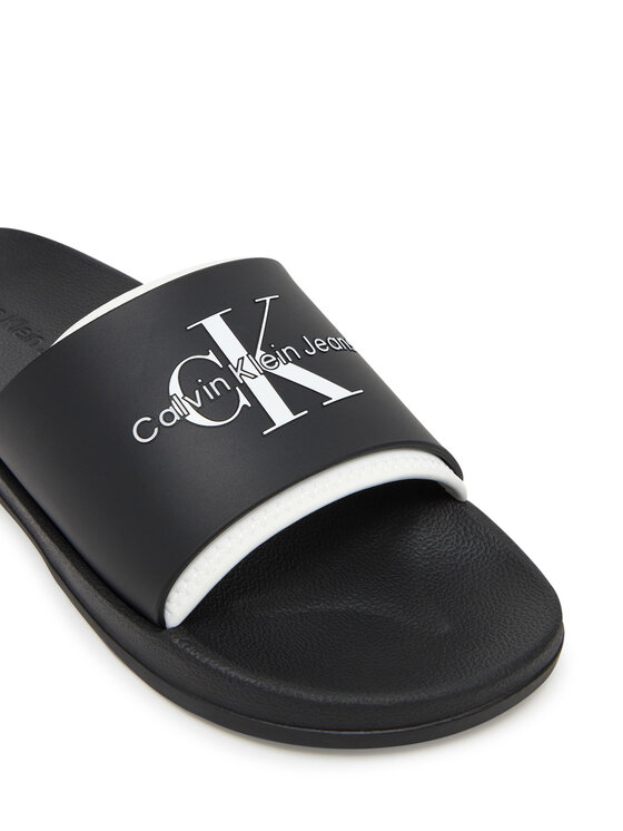 Calvin Klein Jeans Natikači Calvin Klein Jeans Slide Rubber Neoprene Monologo YM0YM00361 Črna
