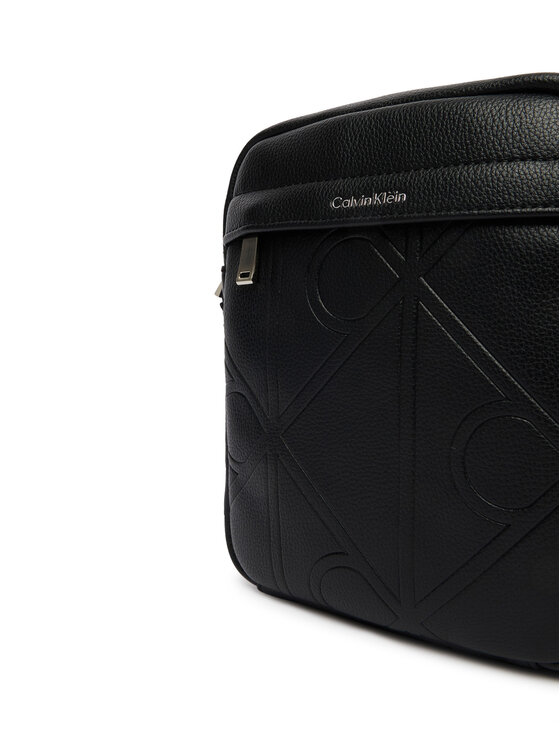 Calvin Klein Geantă crossover Calvin Klein Emblem Aop Emboss Reporter LV04D3331G Negru