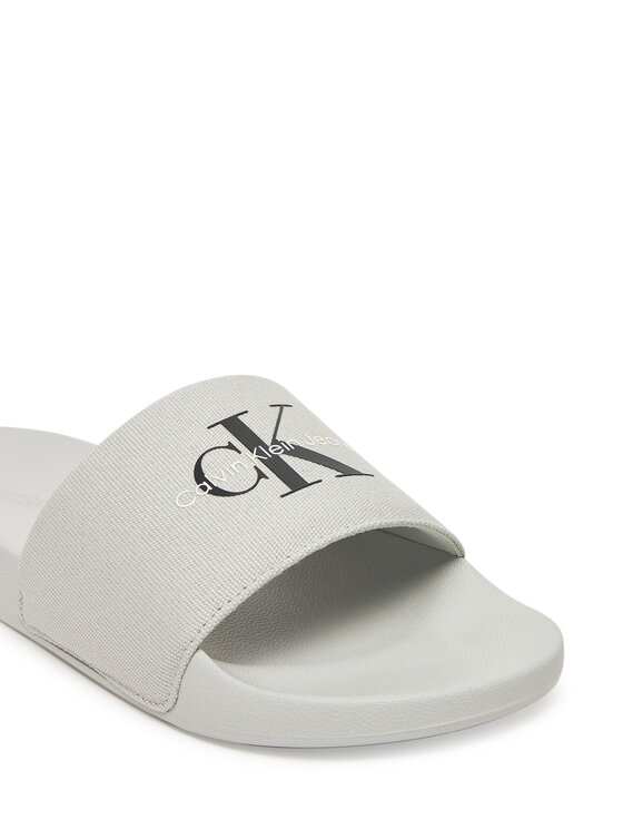 Calvin Klein Jeans Šľapky Calvin Klein Jeans Slide Monogram Cv YM0YM01271 Sivá