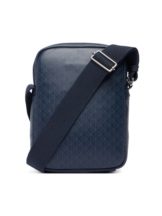 Calvin Klein Crossover torbica Calvin Klein Emblem Aop Coated Slim Reporter LV04D3334G Tamnoplava