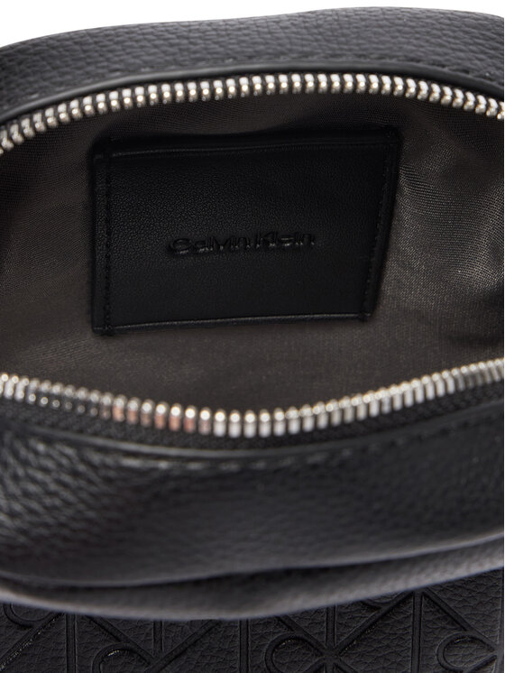 Calvin Klein Maža rankinė Calvin Klein Emblem Aop Emboss Slim Reporter LV04D3228G Juoda