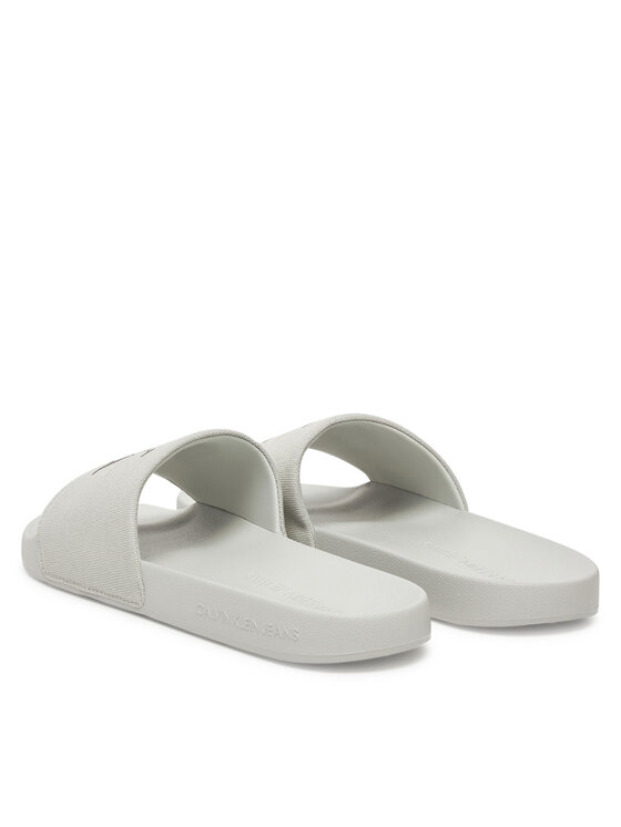 Calvin Klein Jeans Nazouváky Calvin Klein Jeans Slide Monogram Cv YM0YM01271 Šedá