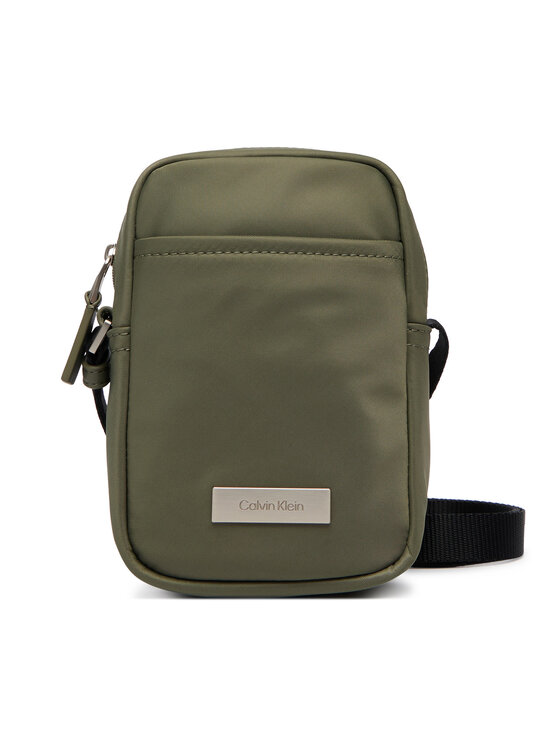 Calvin Klein Torbica za okrog pasu Calvin Klein Sleek Slim Reporter LV04D3233G Zelena