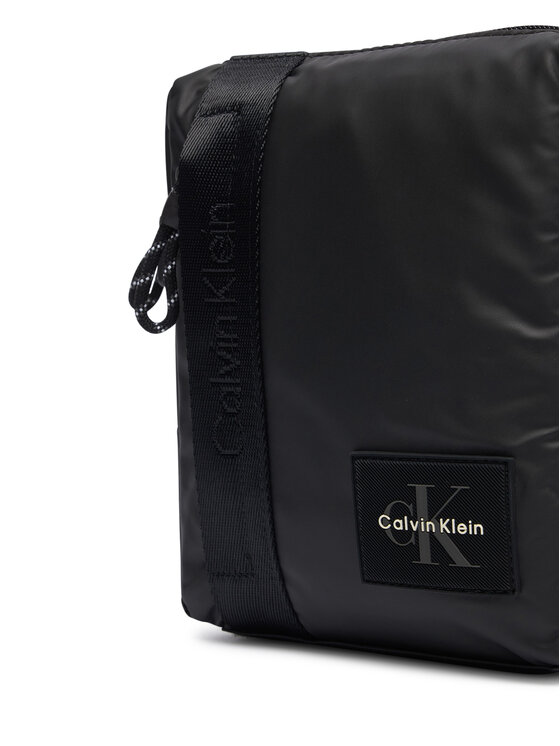 Calvin Klein Somiņa Calvin Klein Rubberized Reporter LV04D3480G Melns