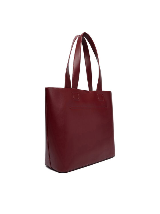 Torebka shopper widziana pod kątem z tyłu, lekko obrócona.