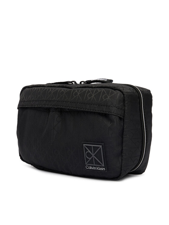 Calvin Klein Kozmetická taštička Calvin Klein Emblem Aop Washbag LV04D1208G Čierna