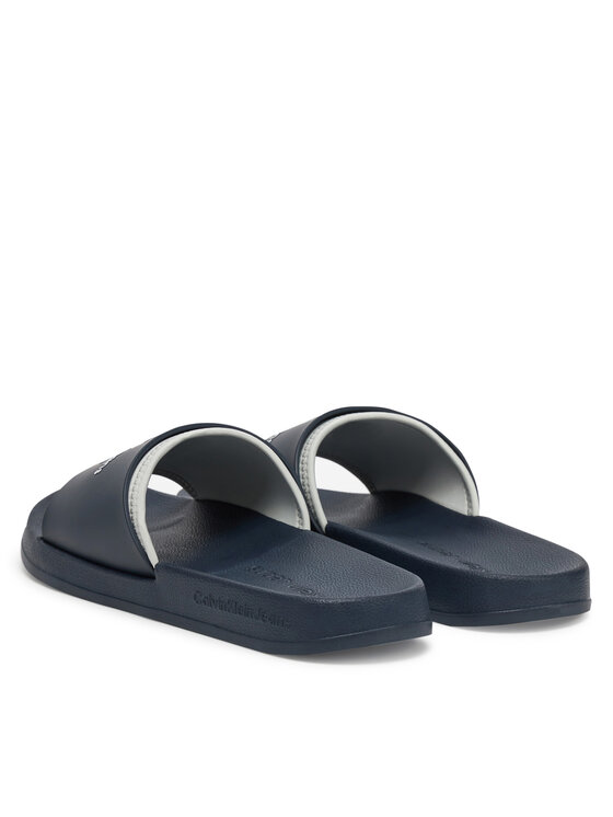 Calvin Klein Jeans Natikači Calvin Klein Jeans Slide Rubber Neoprene Monologo YM0YM00361 Mornarsko modra