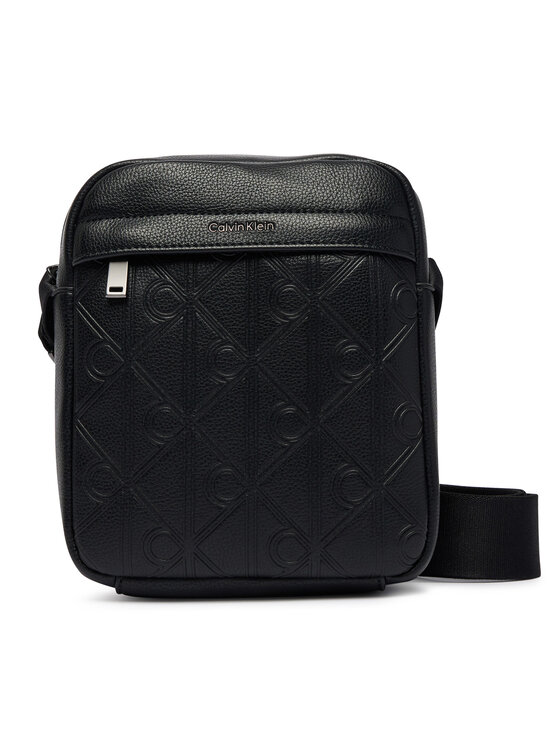Calvin Klein Saszetka Calvin Klein Emblem Aop Deboss Reporter LV04D3562G Czarny