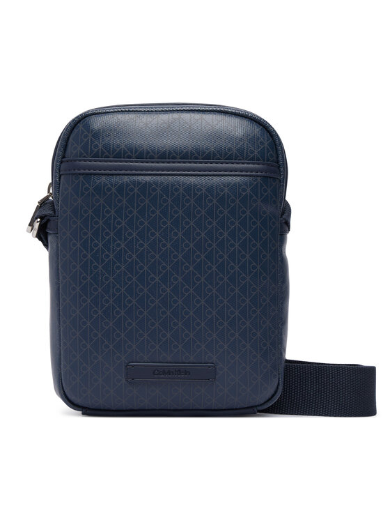 Calvin Klein Crossover torbica Calvin Klein Emblem Aop Coated Slim Reporter LV04D3334G Tamnoplava