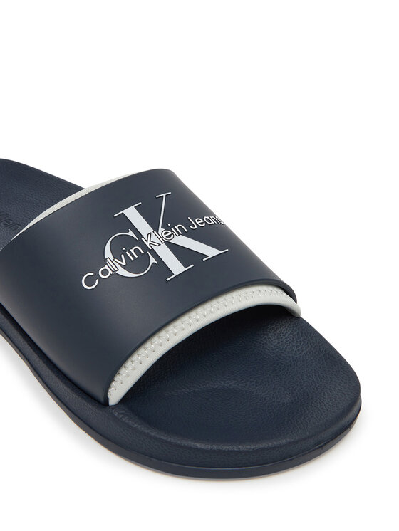 Calvin Klein Jeans Natikači Calvin Klein Jeans Slide Rubber Neoprene Monologo YM0YM00361 Mornarsko modra