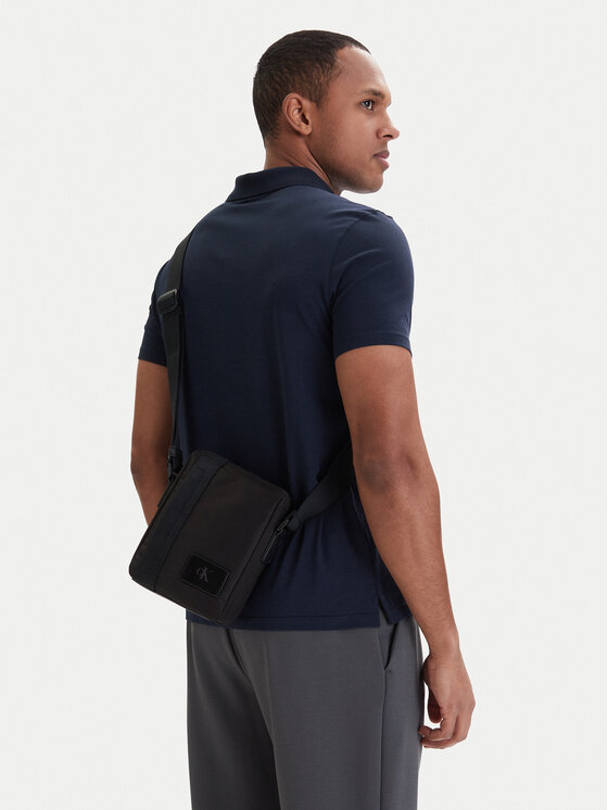 Calvin Klein Torbica za okrog pasu Calvin Klein Canvas Mix Reporter LV04D3366G Črna