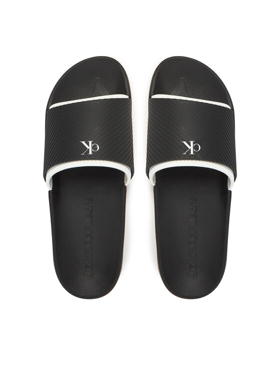 Calvin Klein Jeans Natikači Calvin Klein Jeans Slide Rubber Neoprene Text YM0YM01234 Črna