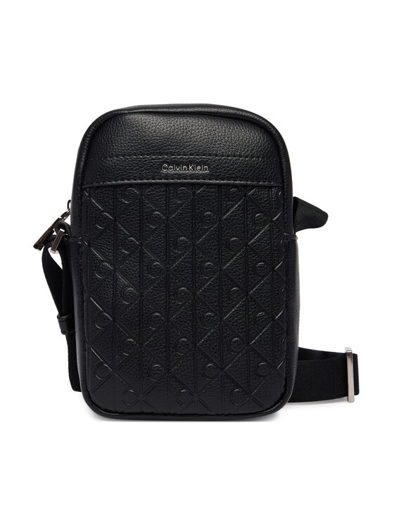 Calvin Klein Saszetka Calvin Klein Emblem Aop Emboss Slim Reporter LV04D3228G Czarny